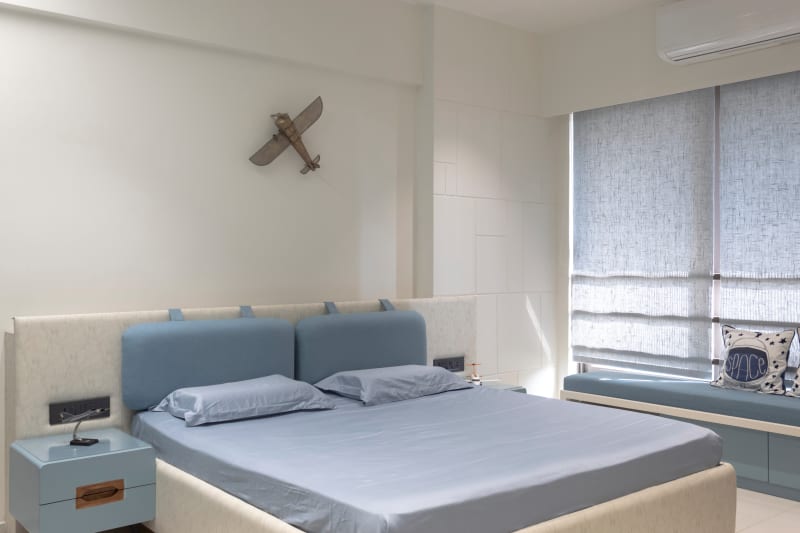 Aviation-themed kids bedroom with window seating