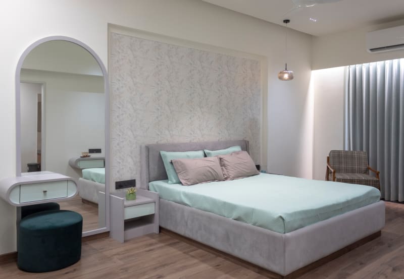 Elegant bedroom interior with bed and dressing vanity