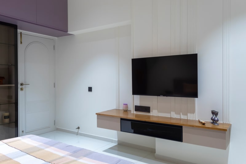 TV unit on wall in modern bedroom