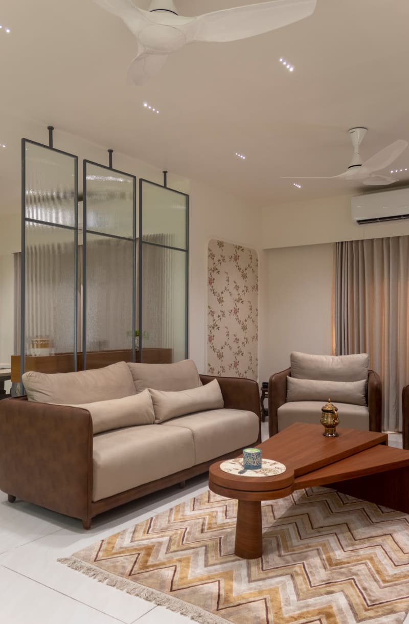 Living room with leather sofa and armchair