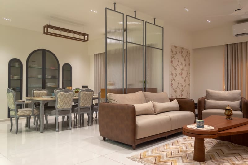 Spacious living area with dining set and partition