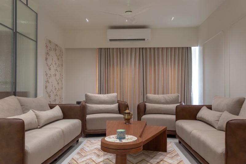 Modern living room with beige sofa set