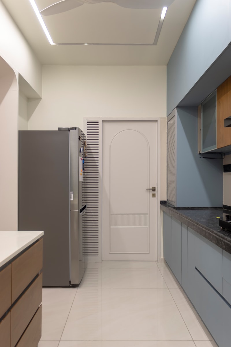 Modern kitchen cabinets with stainless steel refrigerator