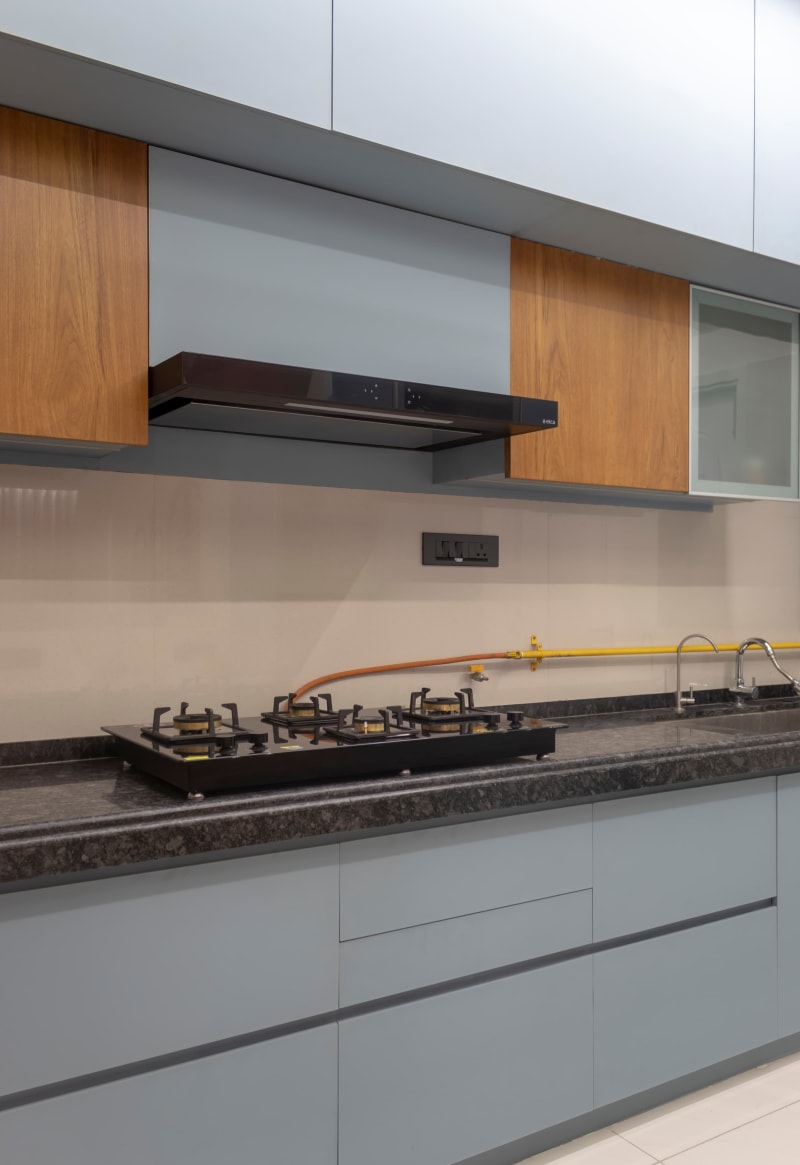 Kitchen countertop with built-in gas stove and chimney