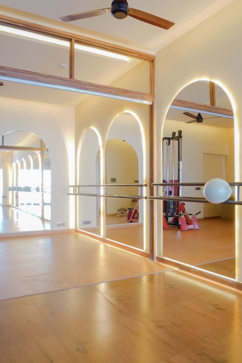 Hallway with arched wood paneled doors