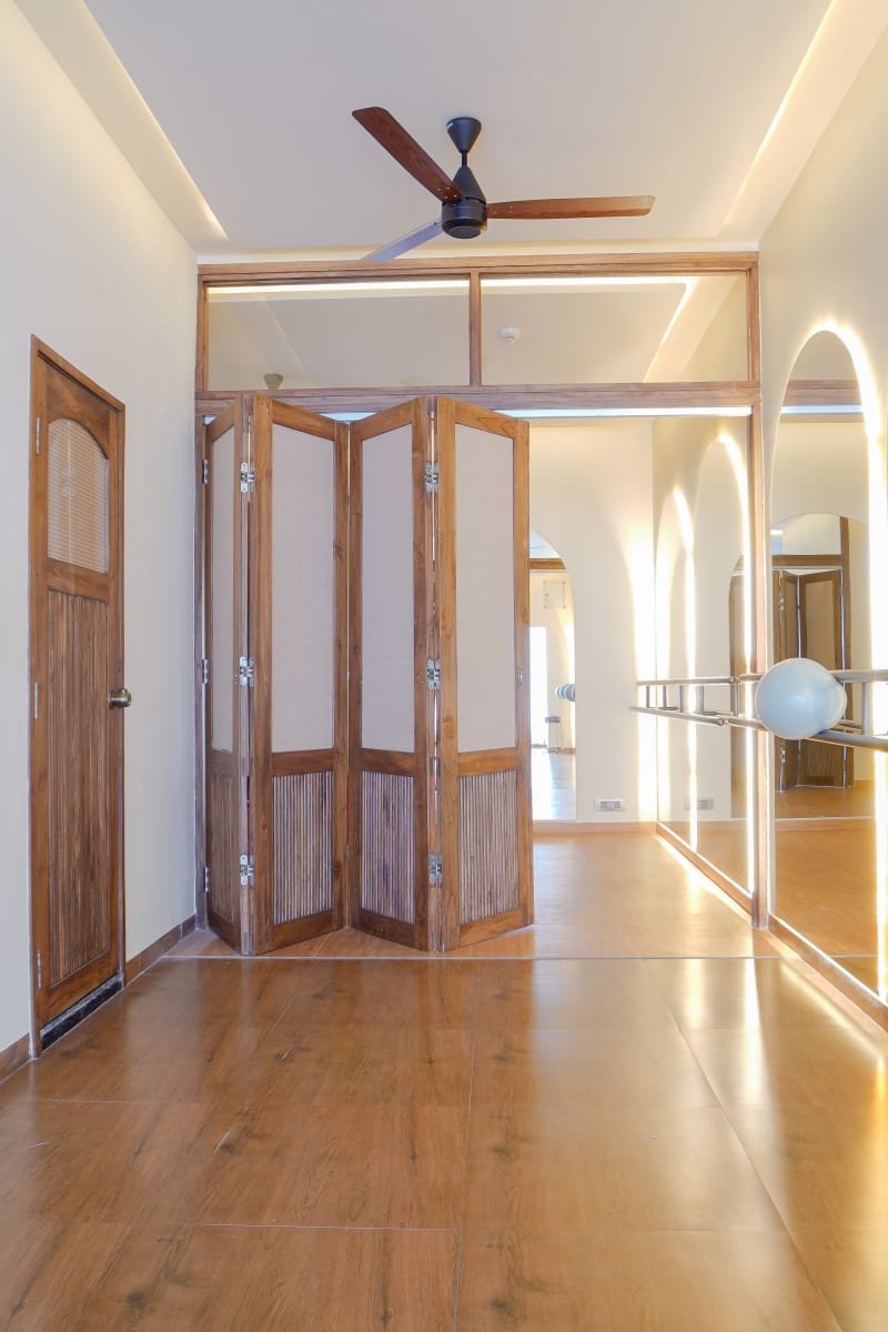 Folding partition door with wooden room door
