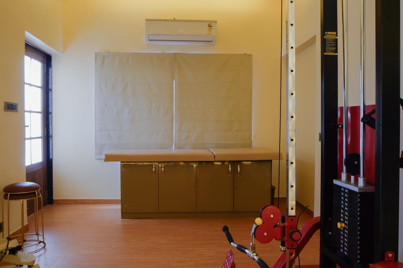 Treatment table and pulley exercise machine