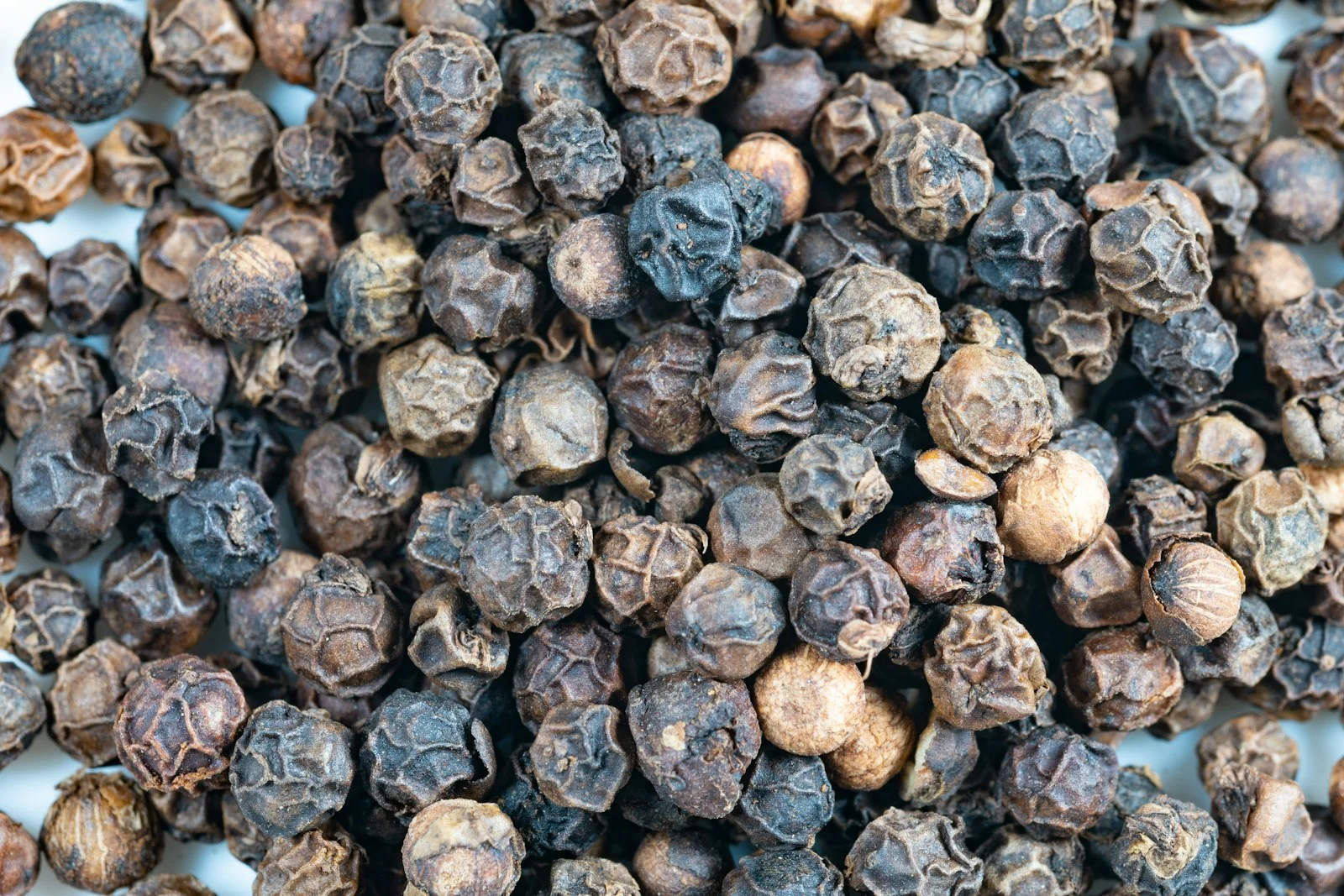Whole black peppercorns