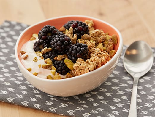 Peachy Berry Granola Yogurt Protein Bowl