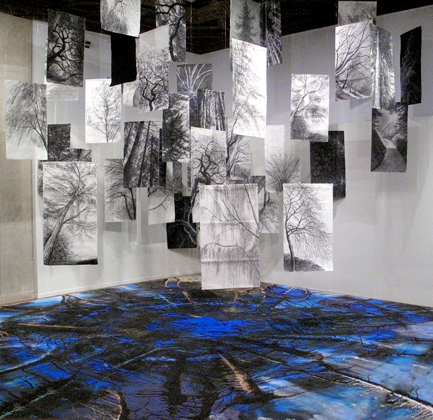 Full view of the 'Floating Trees' charcoal drawings hovering over 'Lake of the Abyss' floor painting at Mills College, 2018