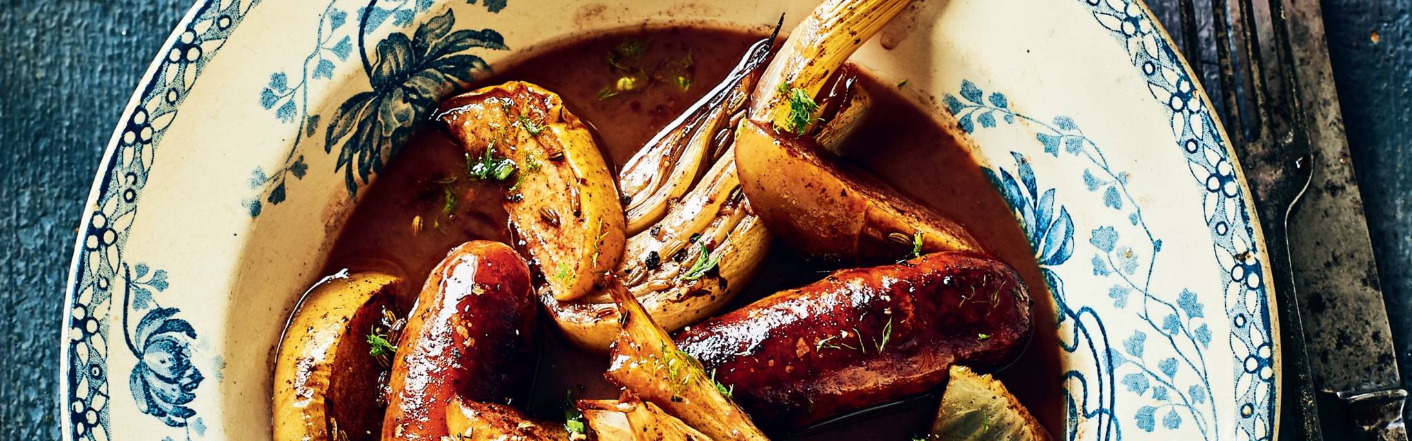 Pork sausages with fennel apples and red wine gravy