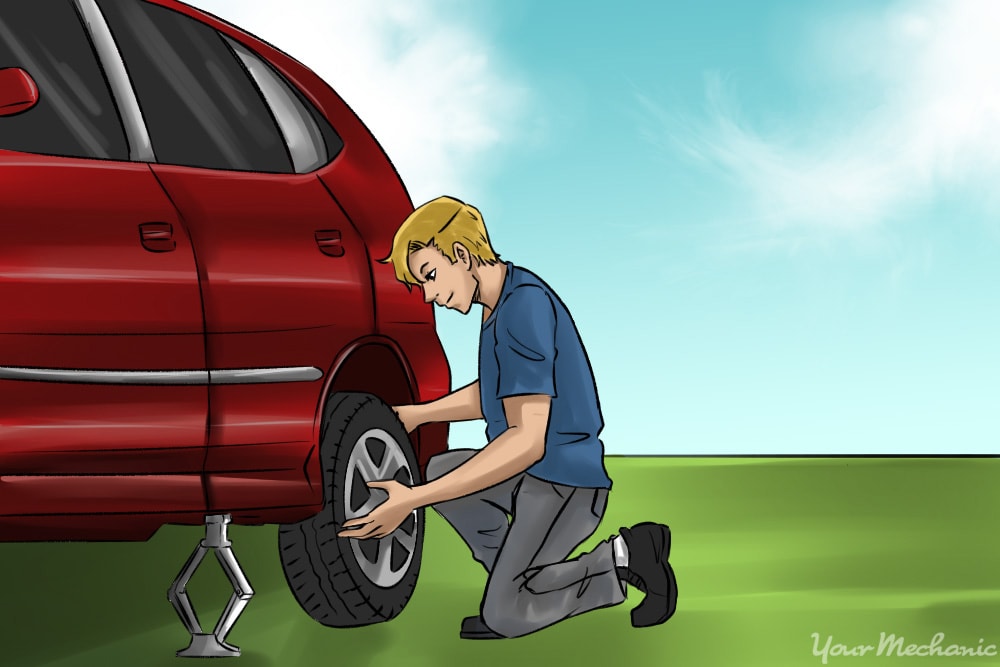 lifting spare tire onto wheel hub