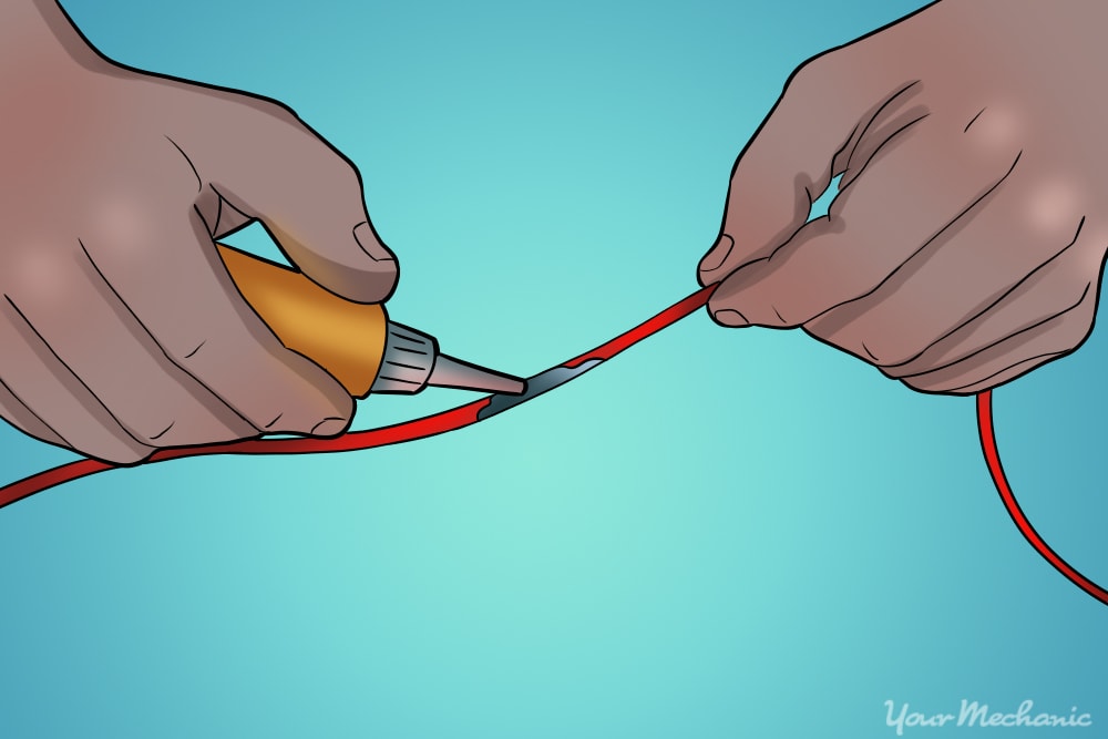 hands adding sealant to the wire 