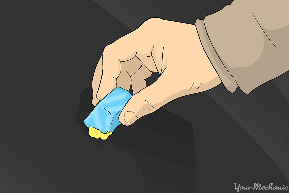 person placing ice onto gum