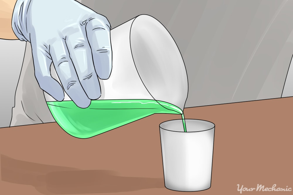 person pouring mixture