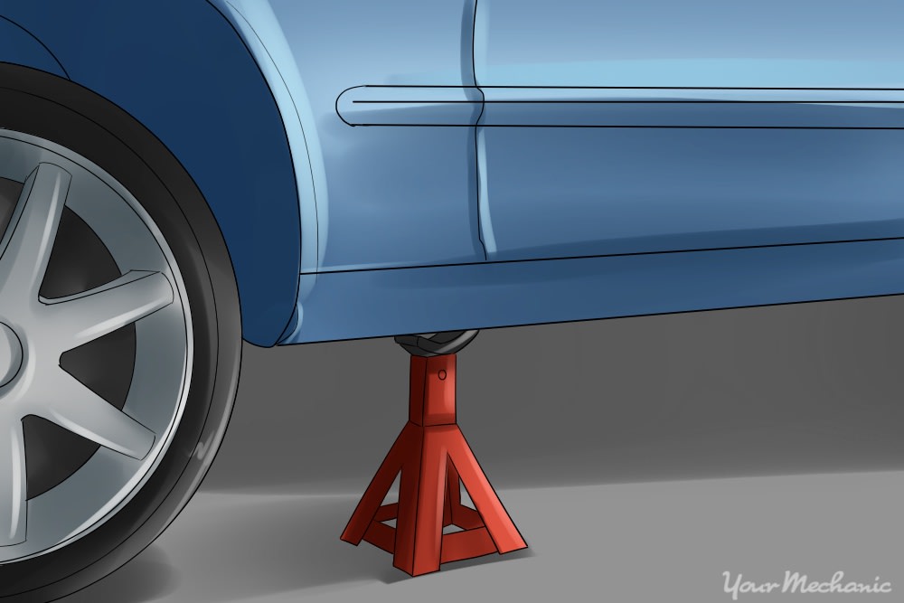 jack stand placed under vehicle