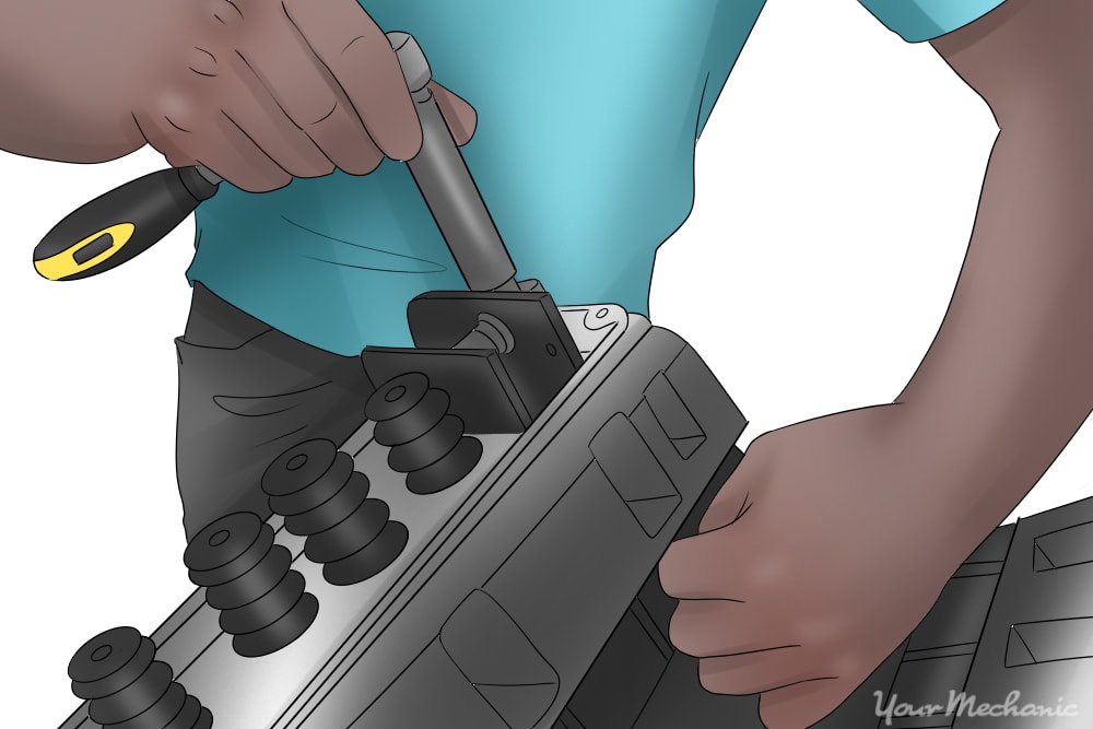 person disassembling the valve train