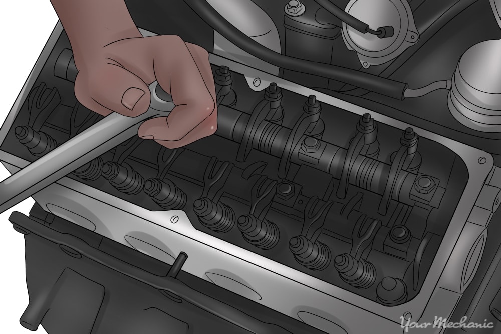 picture of person removing cylinder head bolts