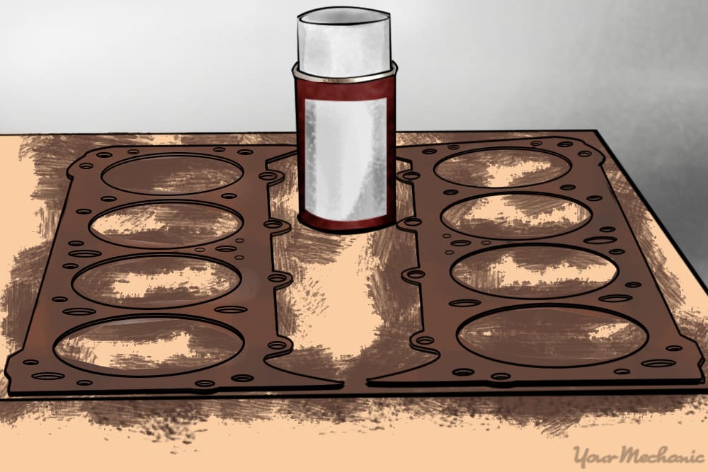 two v8 cylinder head gaskets on a table