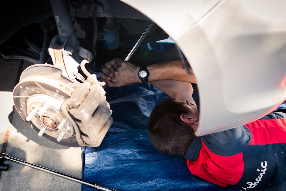 mark under car with big ratchet