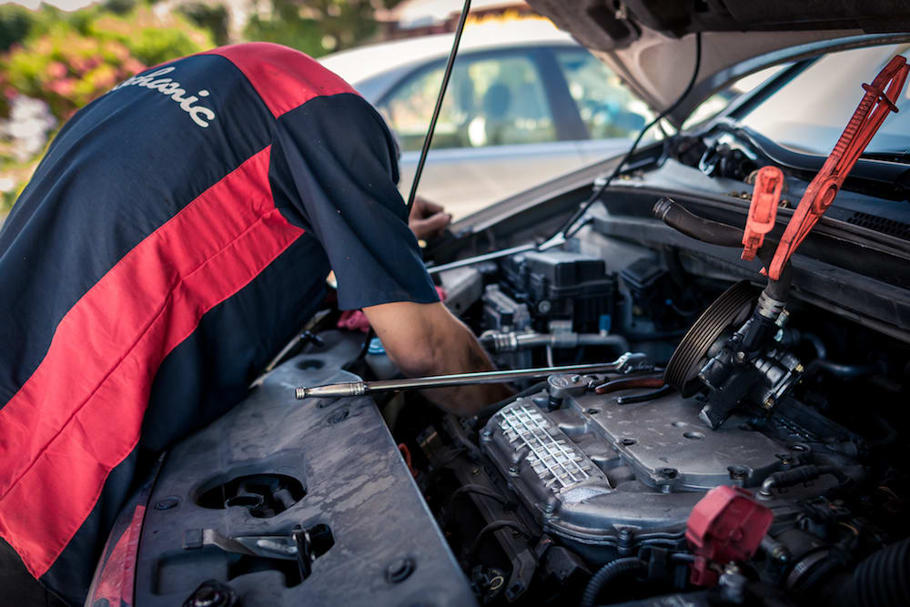 mechanic reaching down