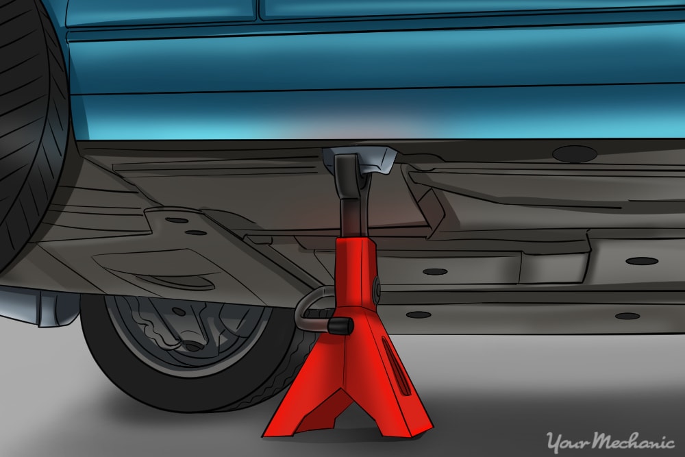 jack stand placed under car