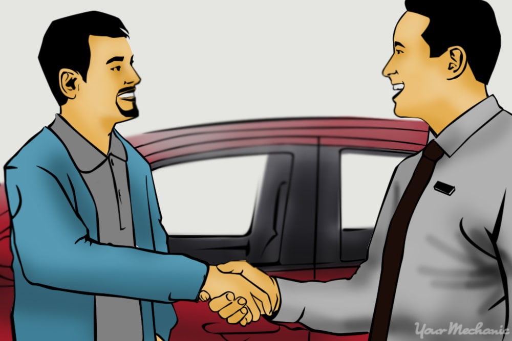 salesman shaking hands with customer