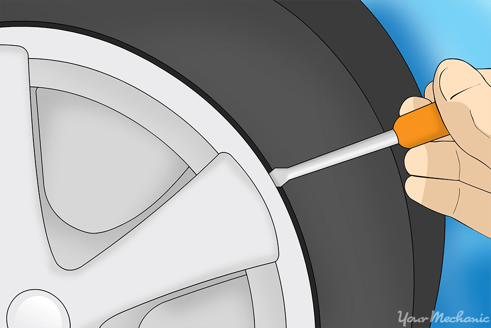 person removing hubcap