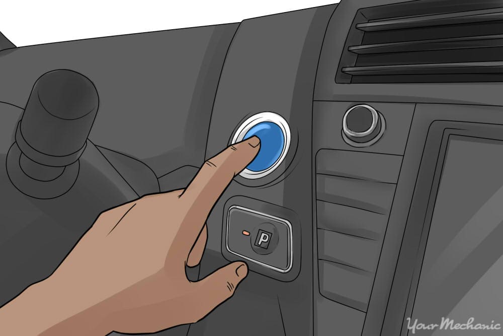 person pressing the engine start/stop button