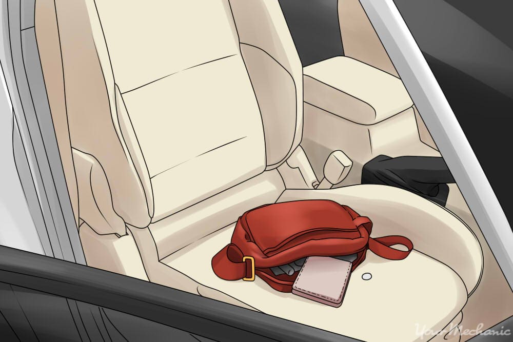 purse laying on a car seat