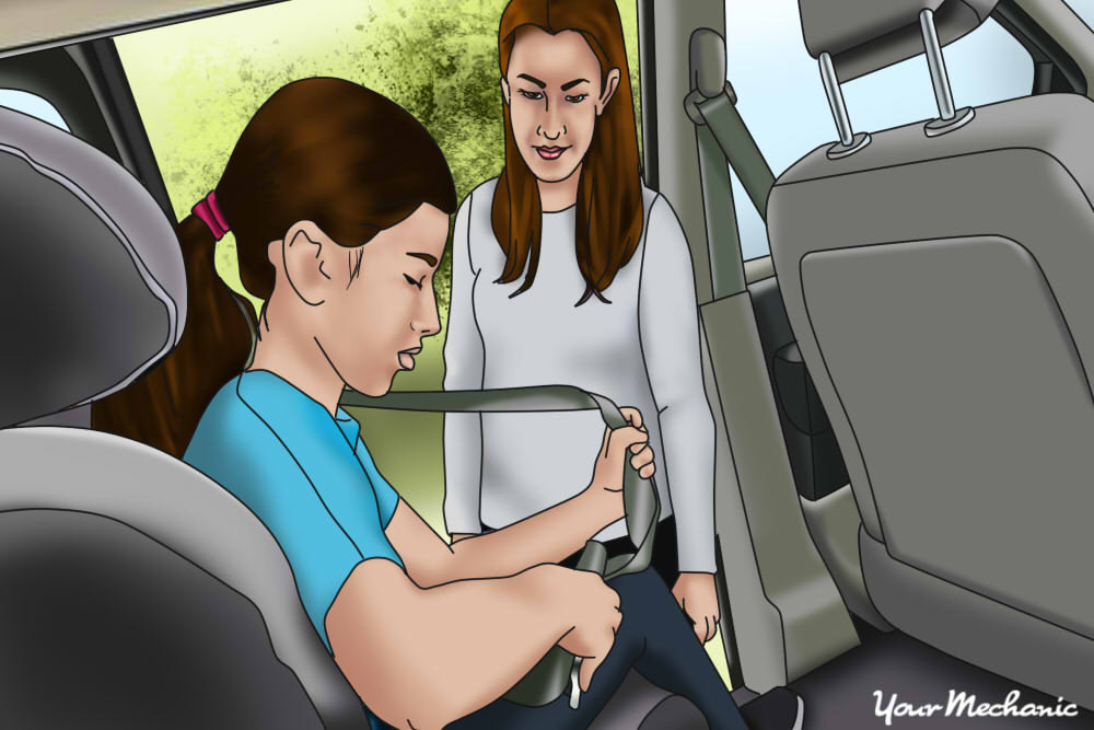 child putting on their seat belt