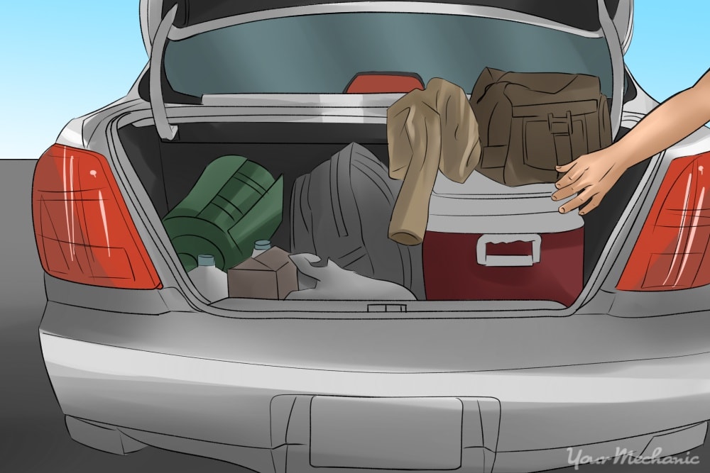 car trunk with cooler and clothes