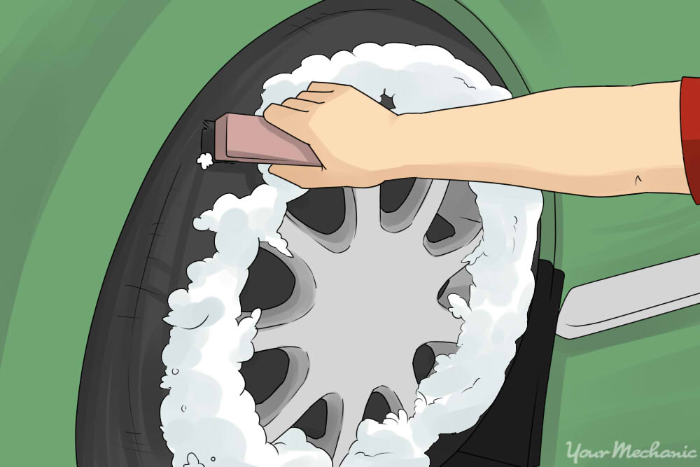 spraying foam on carwheel