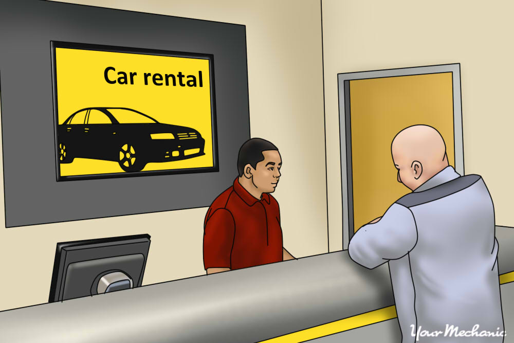 two people speaking with each other at car rental agency