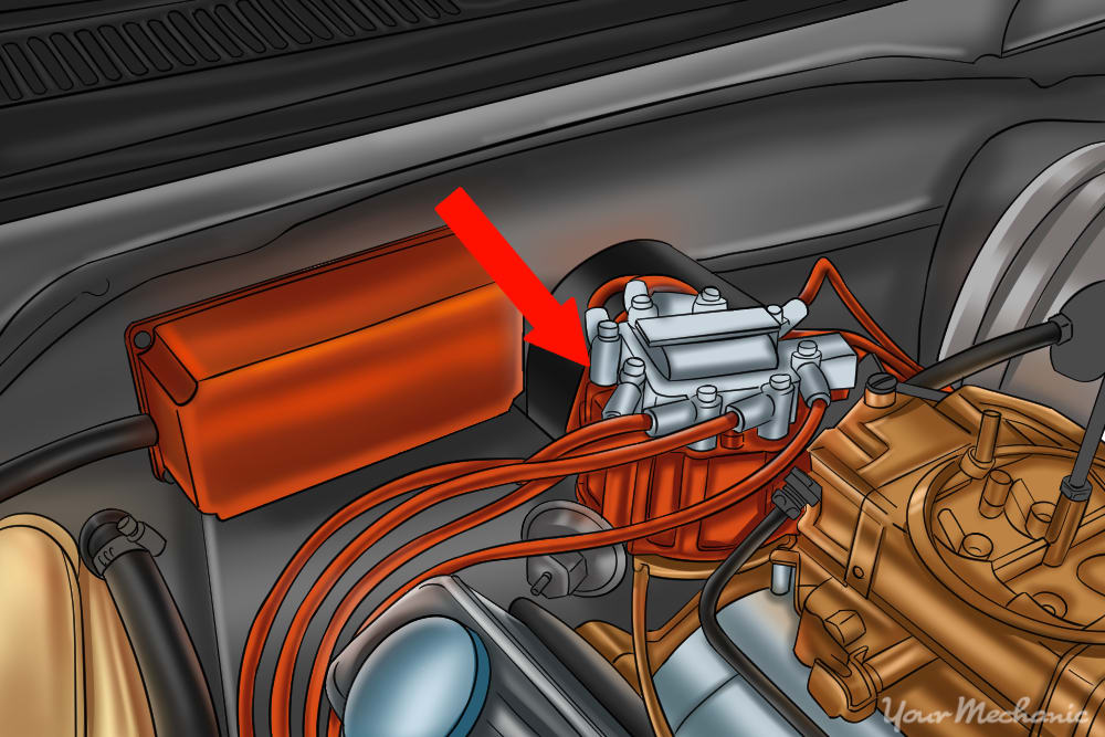 green arrow pointing to a distributor inside an open engine