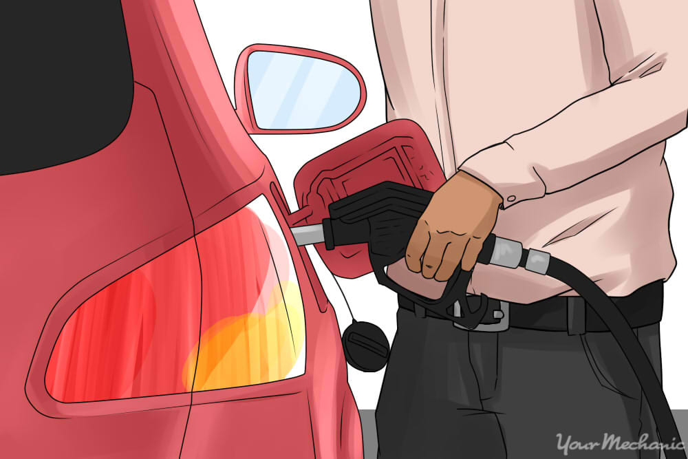 person filling up car with gas