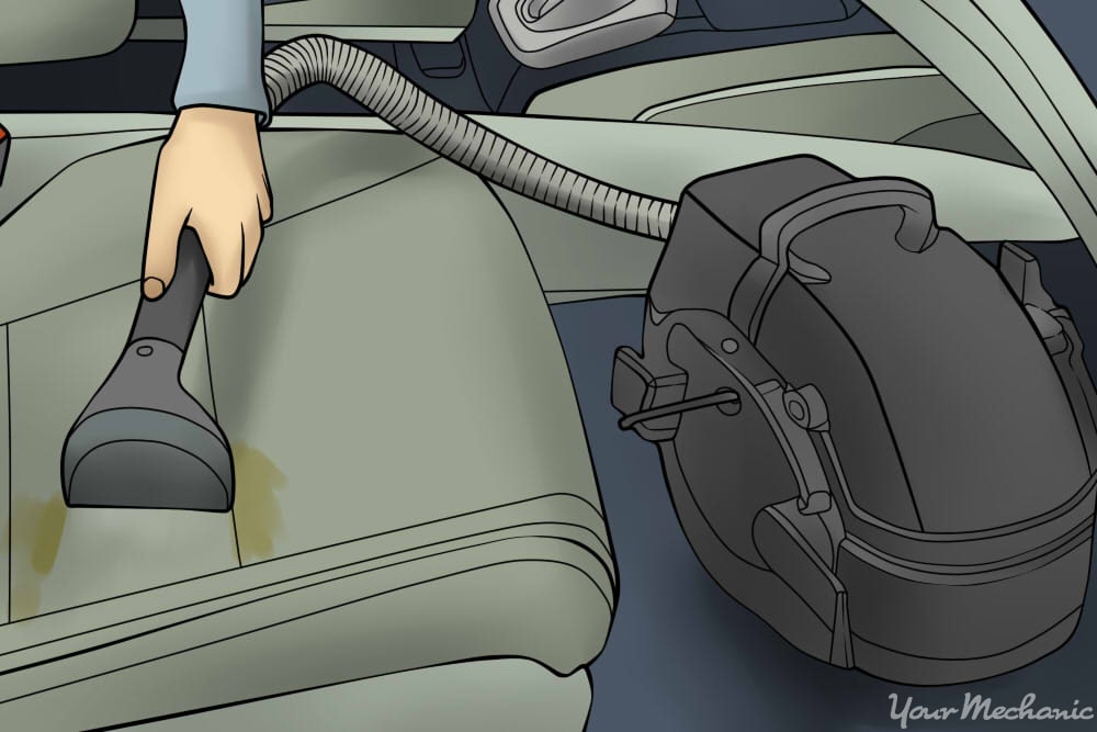 steam cleaner cleaning car seat