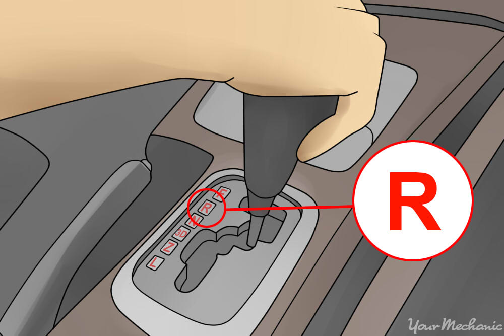 3_How_to_Drive_a_Car_in_Reverse_Gear_a_hand_on_the_shifter_of_an_automatic_transmission_gear_shifter_on_the_floor_of_the_vehicle