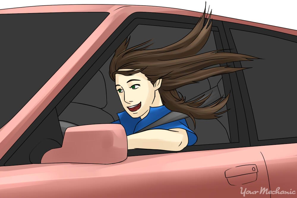 girl driving with window down