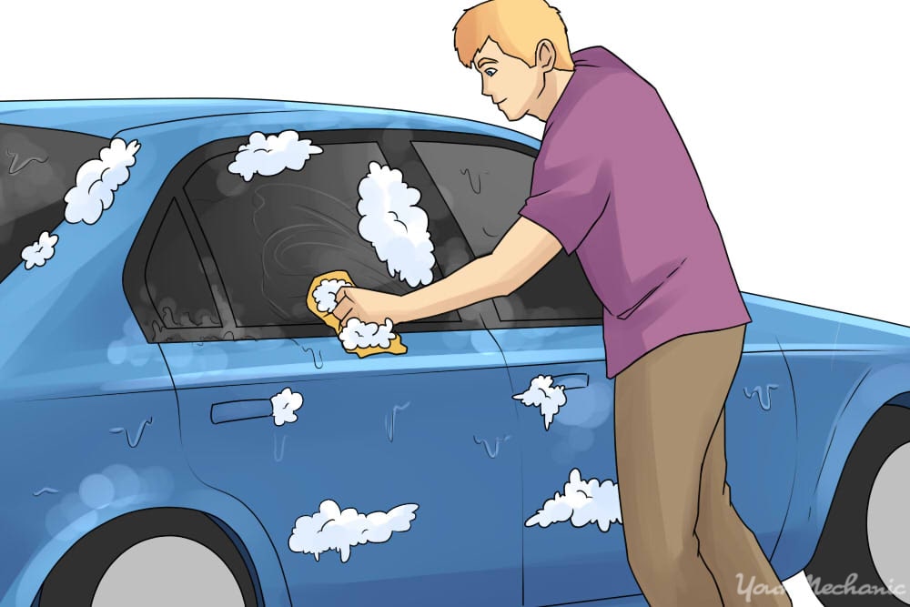 person cleaning car