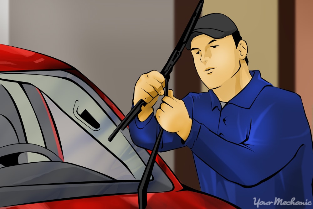 man lifting wipers from windshield