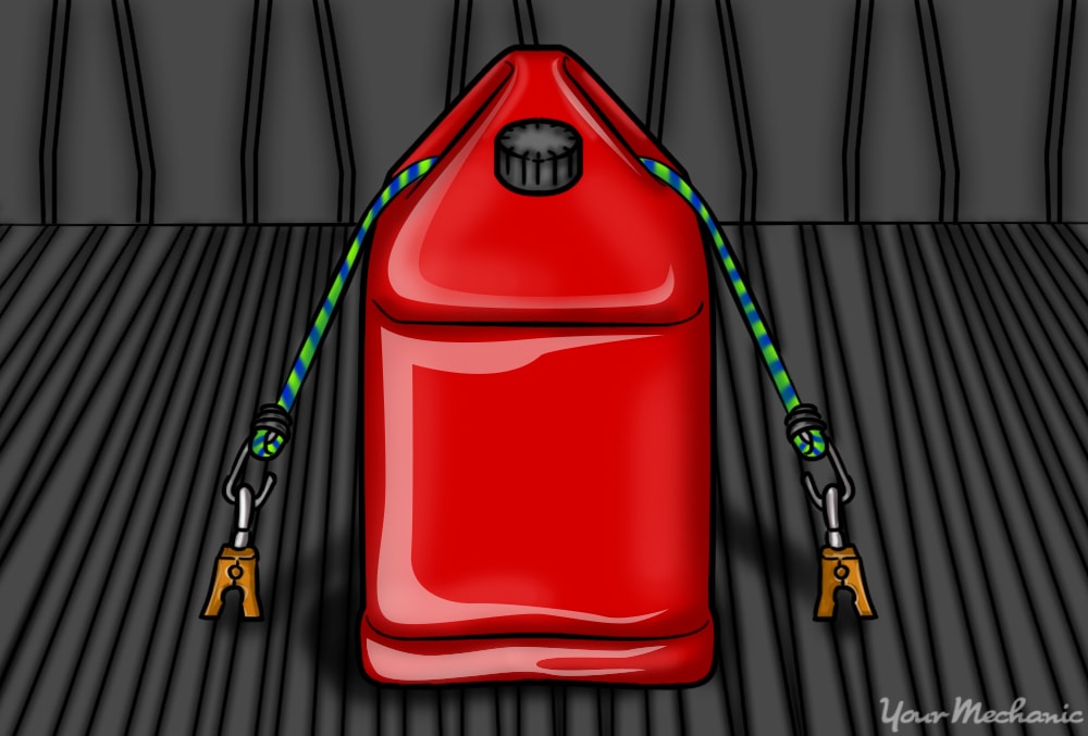 red fuel can securing it to trunk