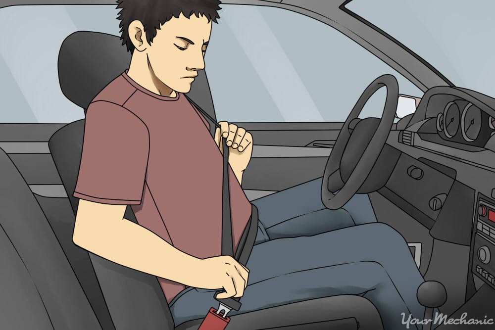 man buckling his seat belt