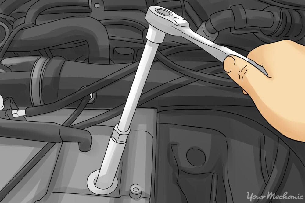 person removing the spark plugs