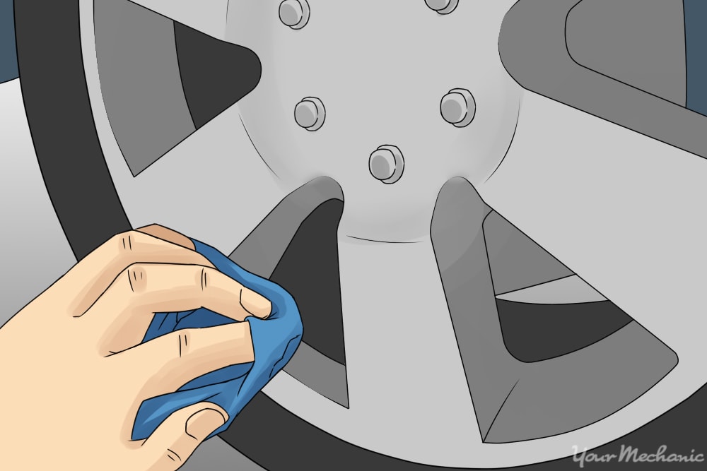 wiping polish into wheel