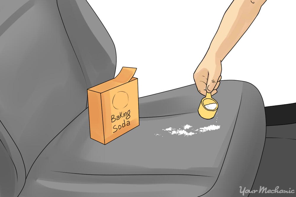 person pouring baking soda onto seat