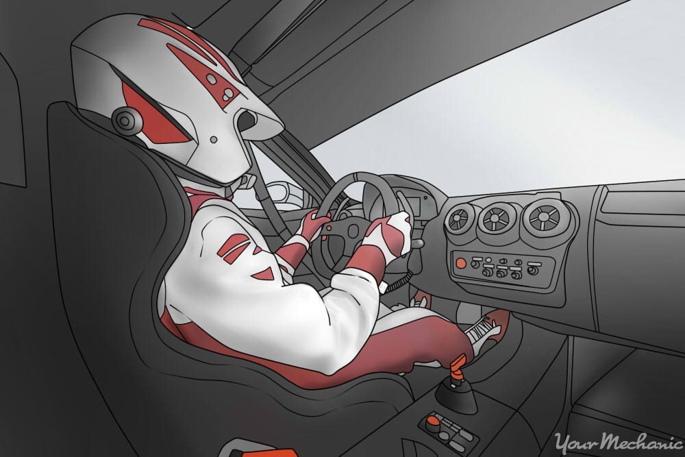 person inside of a racecar driving