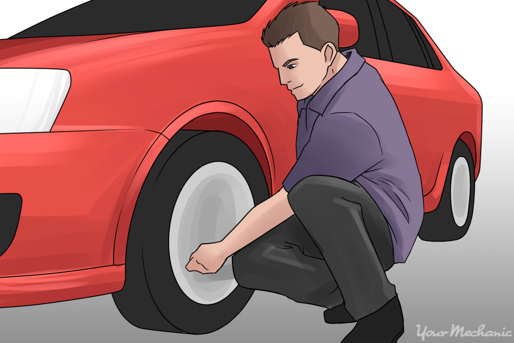 person inspecting tires