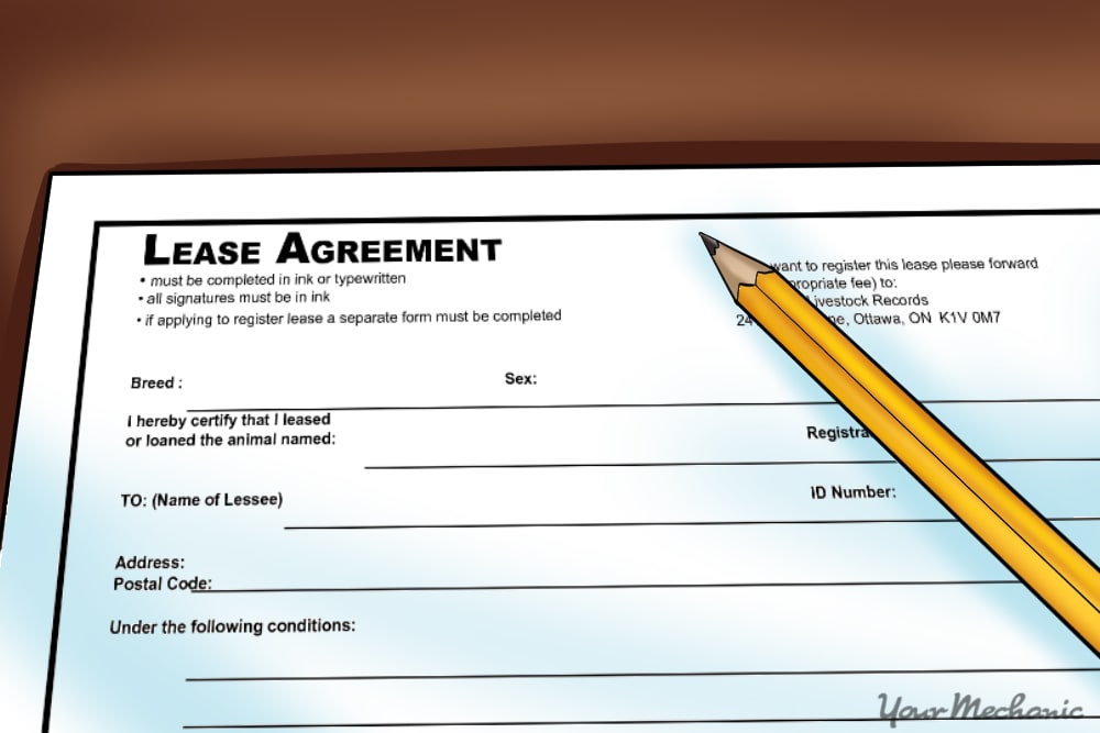 example of paperwork for a car lease with a pencil nearby