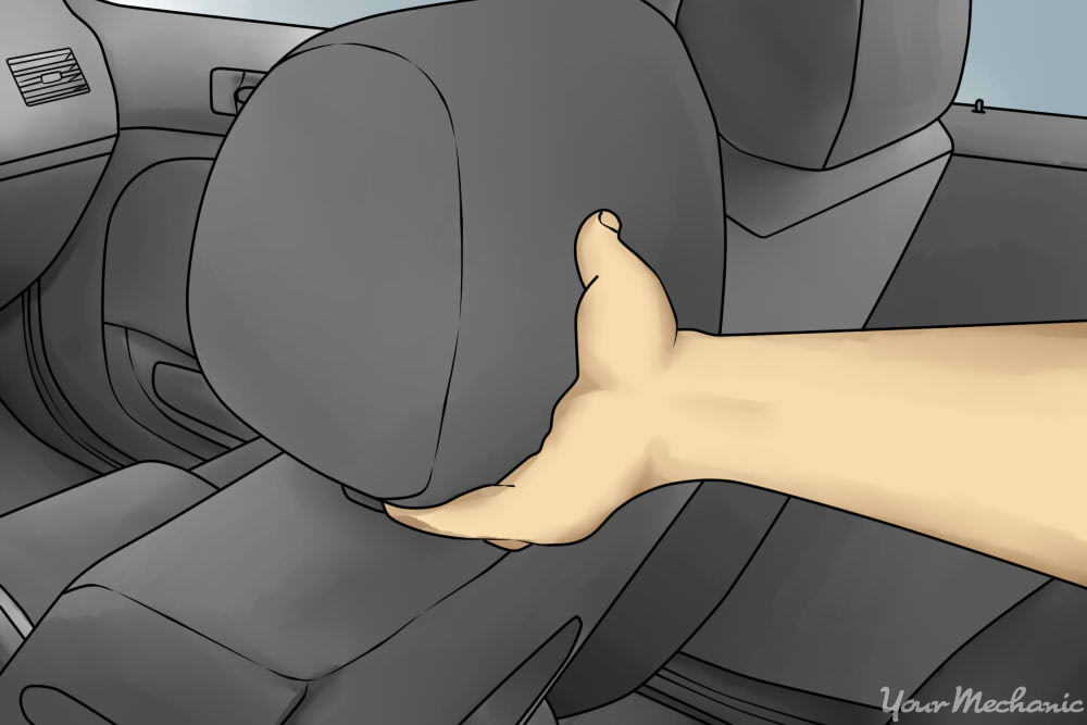 hand removing headrest